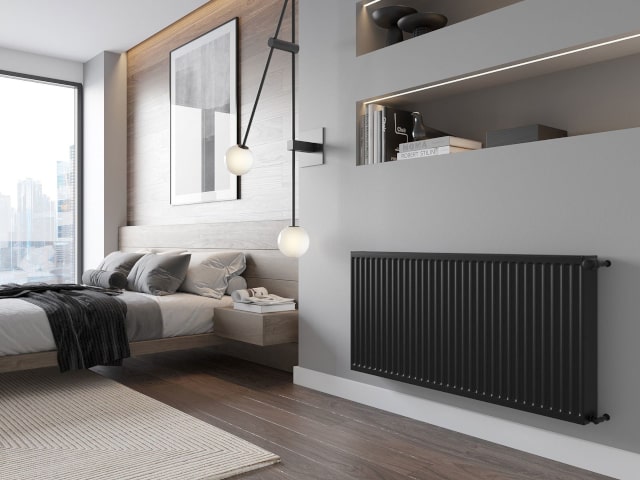 Zwarte radiator in kamer
